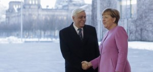 German Chancellor Angela Merkel, right, welcomes the President of Greece Prokopis Pavlopoulos for talks at the chancellery in Berlin, Monday, Jan. 18, 2016. (AP Photo/Markus Schreiber)