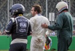 epa05222222 Spanish Formula One driver Fernando Alonso of McLaren-Honda walks away from the track after crashing with Mexican Formula One driver Esteban Gutierrez (unseen) of Haas F1 Team during the Australian Formula One Grand Prix at the Albert Park circuit in Melbourne, Australia, 20 March 2016.  EPA/SRDJAN SUKI