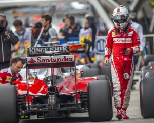 epa05284439 German Formula One driver Sebastian Vettel of Scuderia Ferrari after the qualifying session at the Sochi Autodrom circuit, in Sochi, Russia, 30 April 2016. The 2016 Formula One Grand Prix of Russia will take place on 01 May 2016.  EPA/SRDJAN SUKI