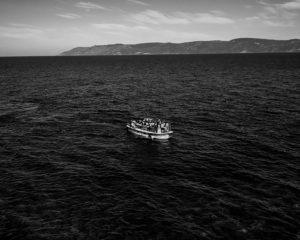 Refugees arrive on the Greek island of Lesbos after crossing the Aegean sea from Turkey on October 26, 2015.