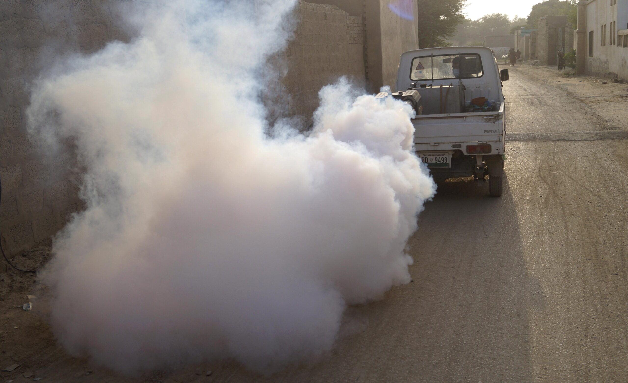 Municipal workers spray pesticides to contain spread of dengue mosquitos in Dera Ismail Khan