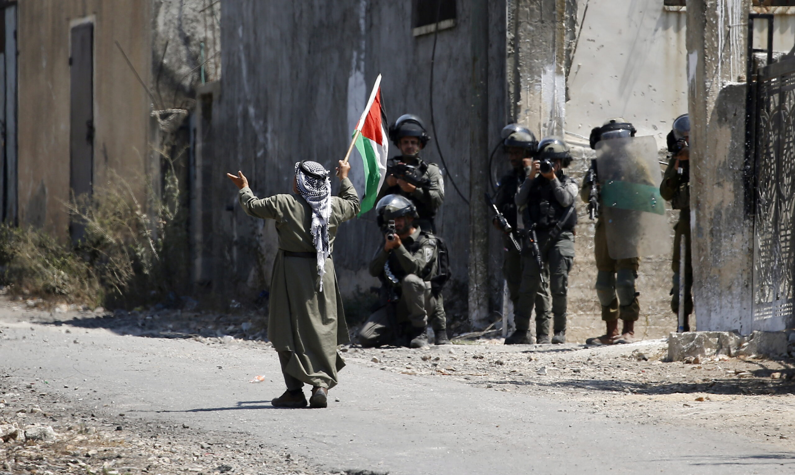 Palestinian protesters clash with Israeli troops near the West Bank city of Nablus