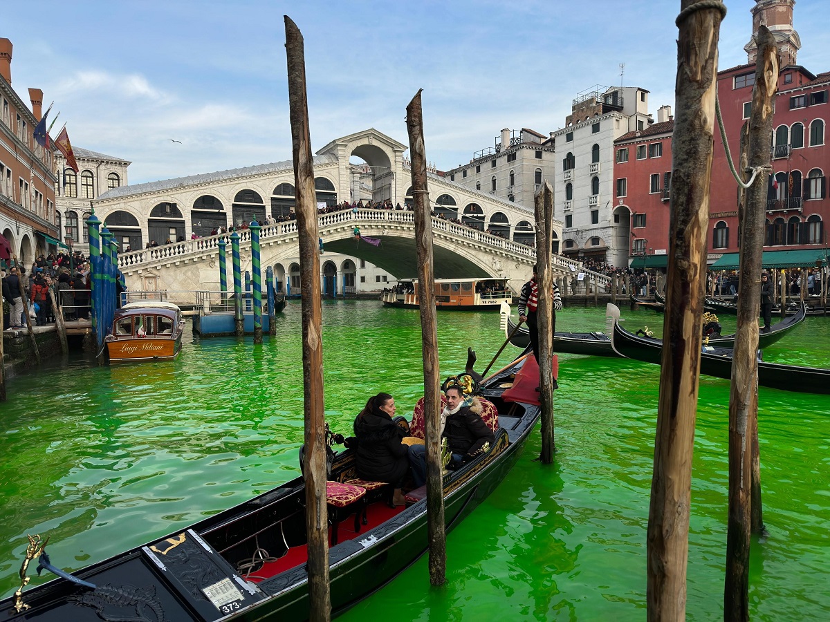 Waters of Venice Canal Grande turned green by climate activists