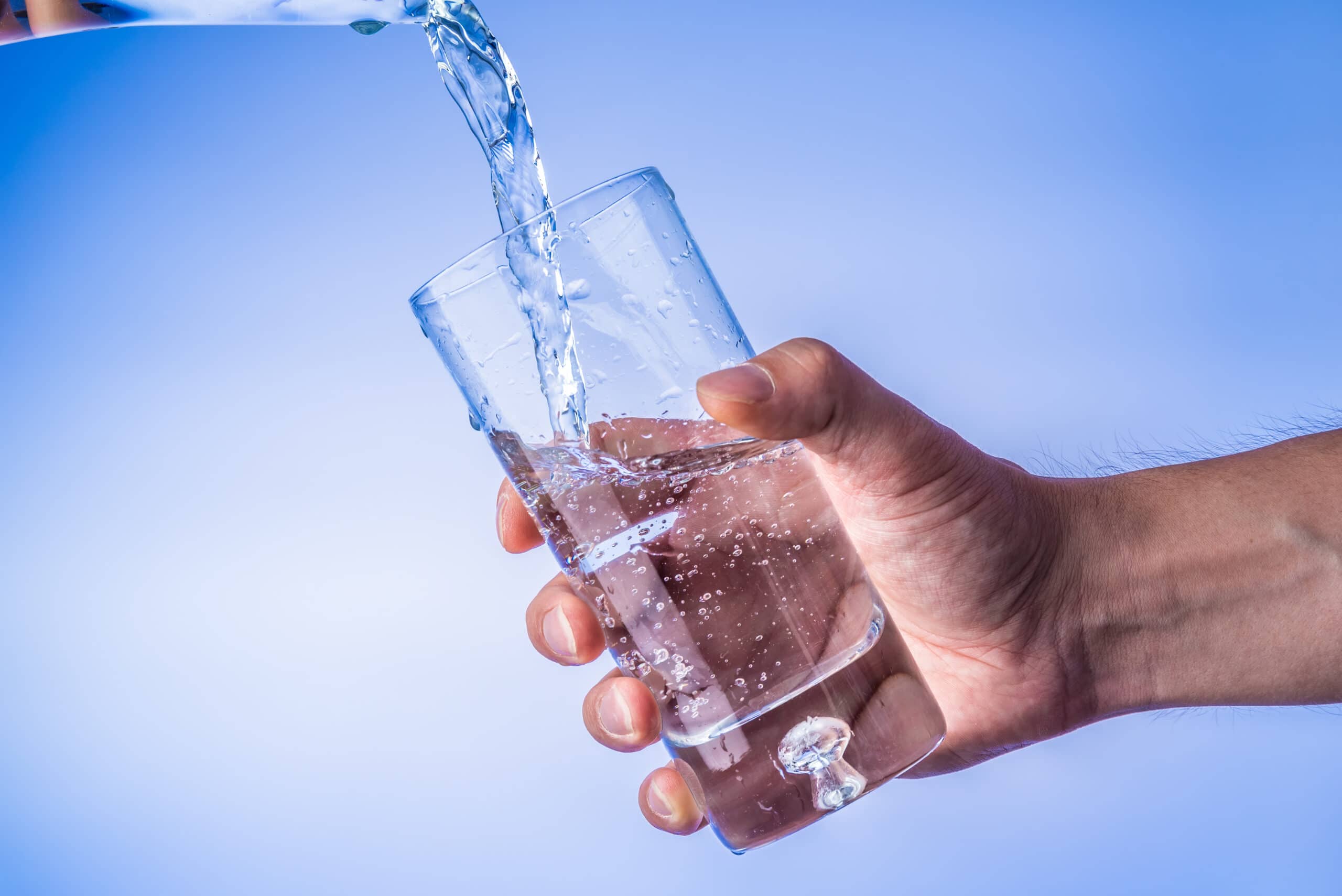 filling-up-the-glass-with-water-hand-holding-glas-2021-04-05-10-33-39-utc-scaled