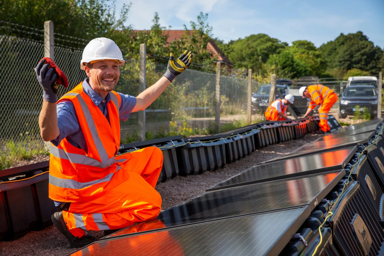 leo-possible-director-grins-as-he-polishes-a-solar-panel